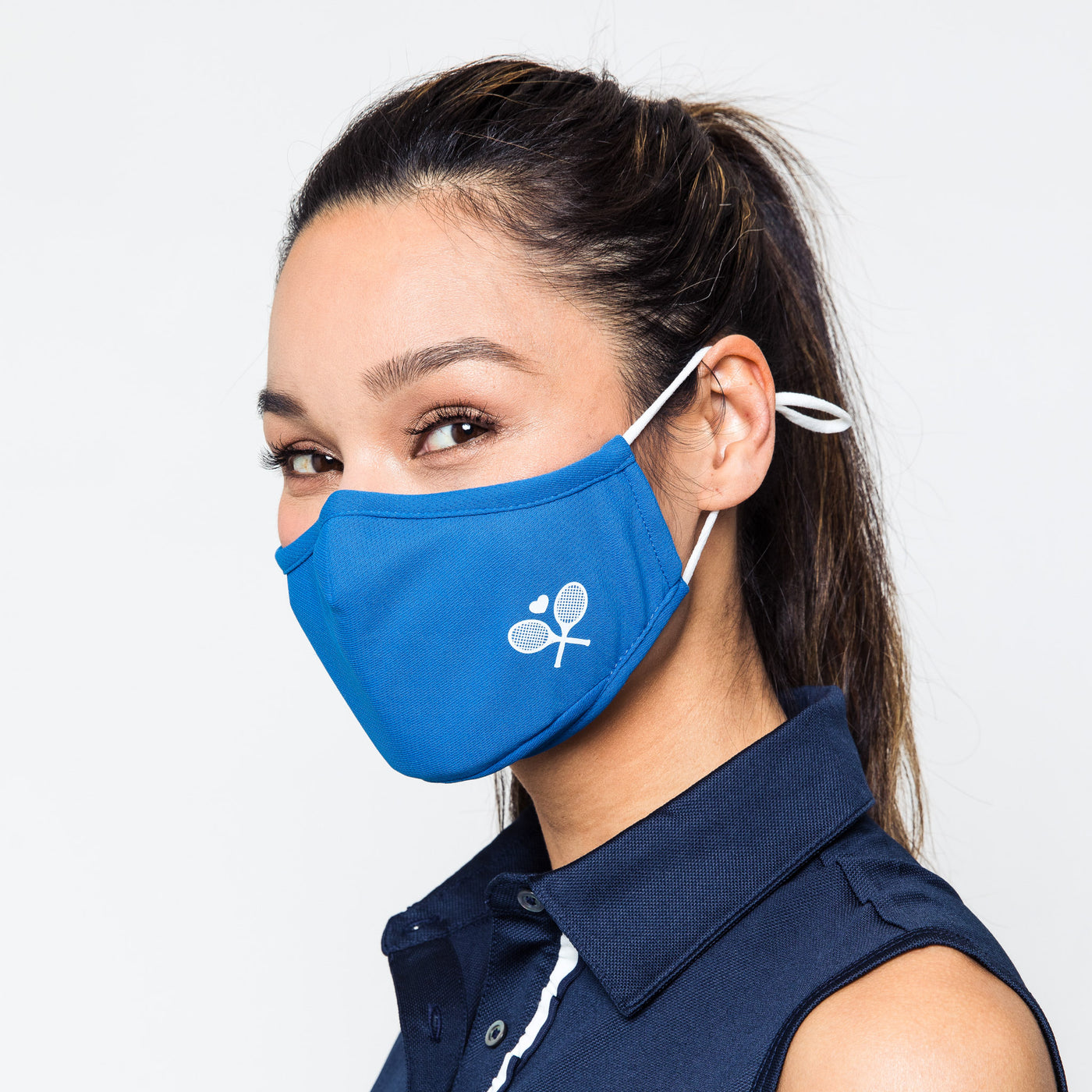 bright blue face mask with white crossed racquets printed on one side