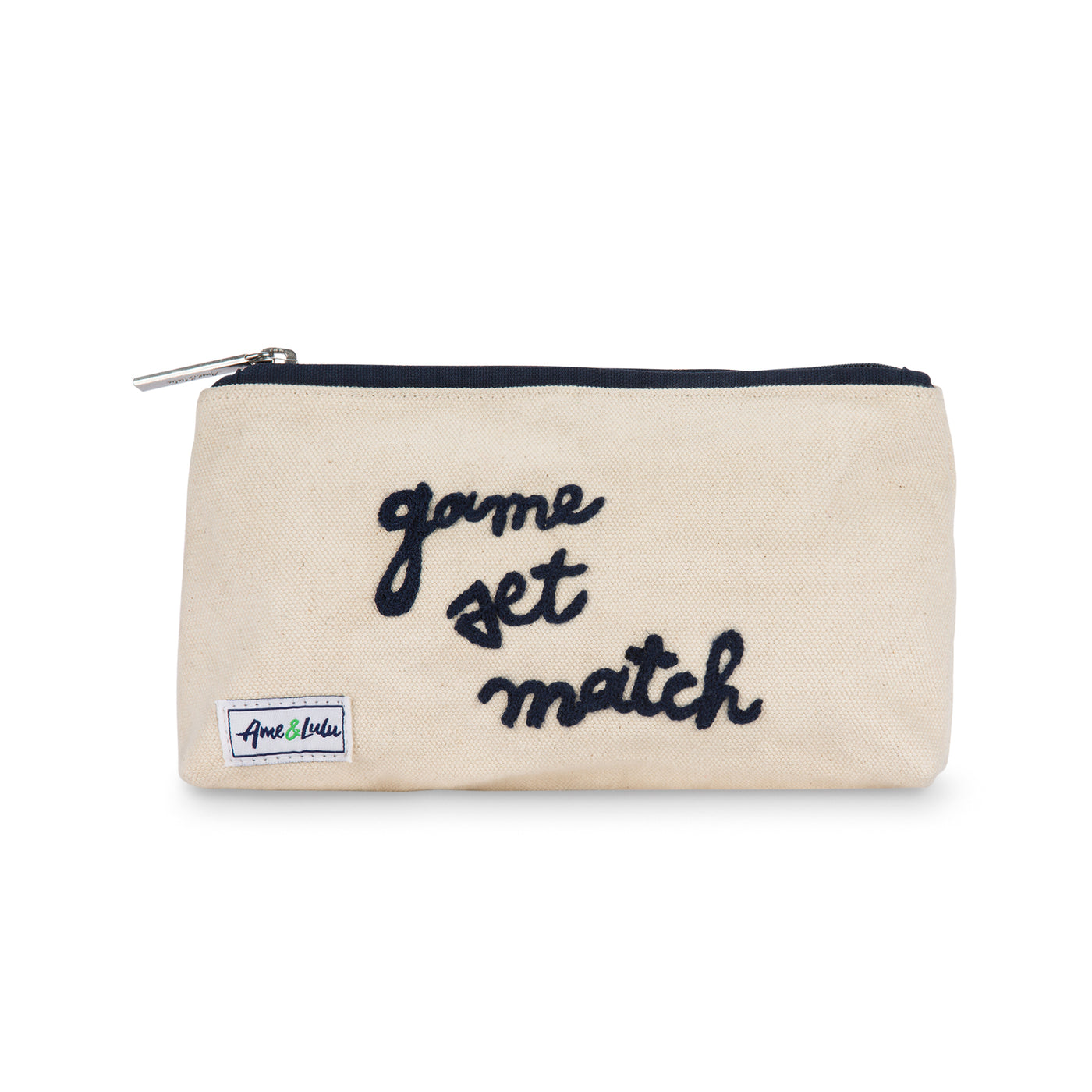 Front view of small canvas makeup pouch with navy zipper. Front has the words game set match embroidered on.