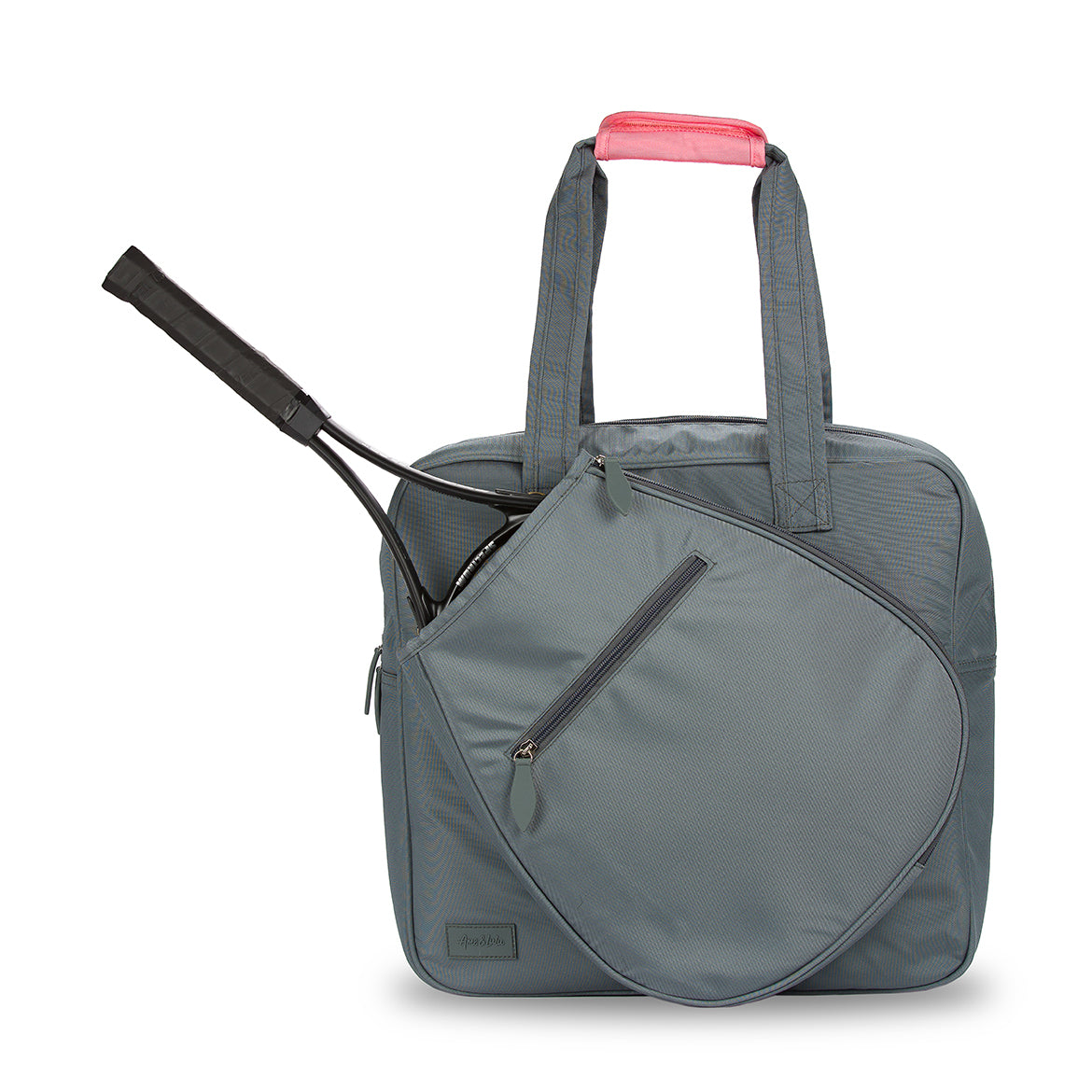 Front view of charcoal grey tennis tote with tennis racquet in front pocket. Tote has coral pink handle cap.