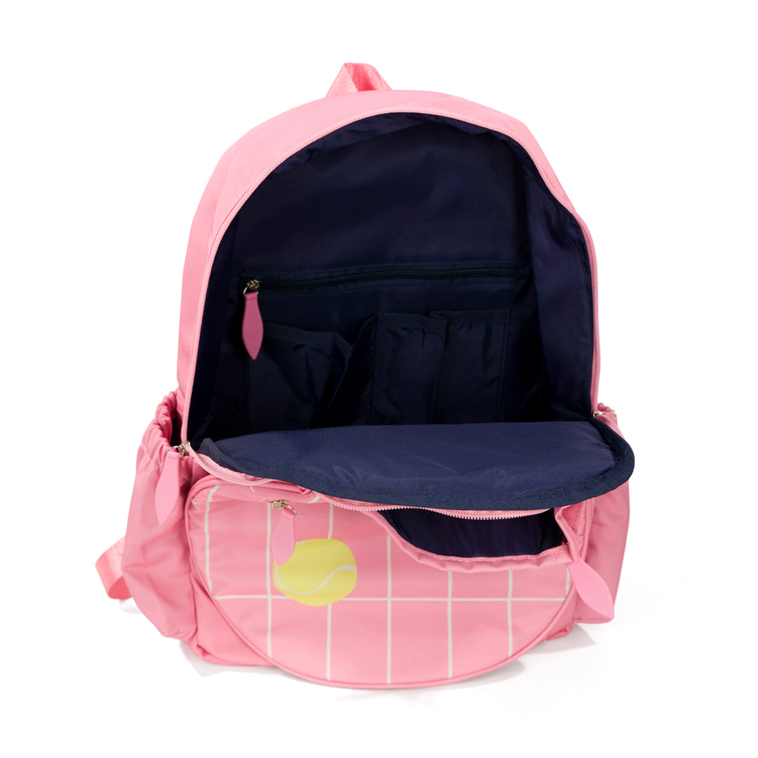 Inside view of coral kids tennis backpack with repeating pattern of cream grid lines and yellow tennis balls. Interior is navy.