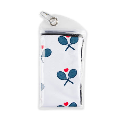 White sport towel with navy racquets folded into small carrying pouch.