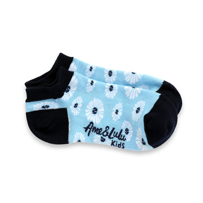 pair of light blue kids socks with navy heel and toes, and white daisies stitched on socks