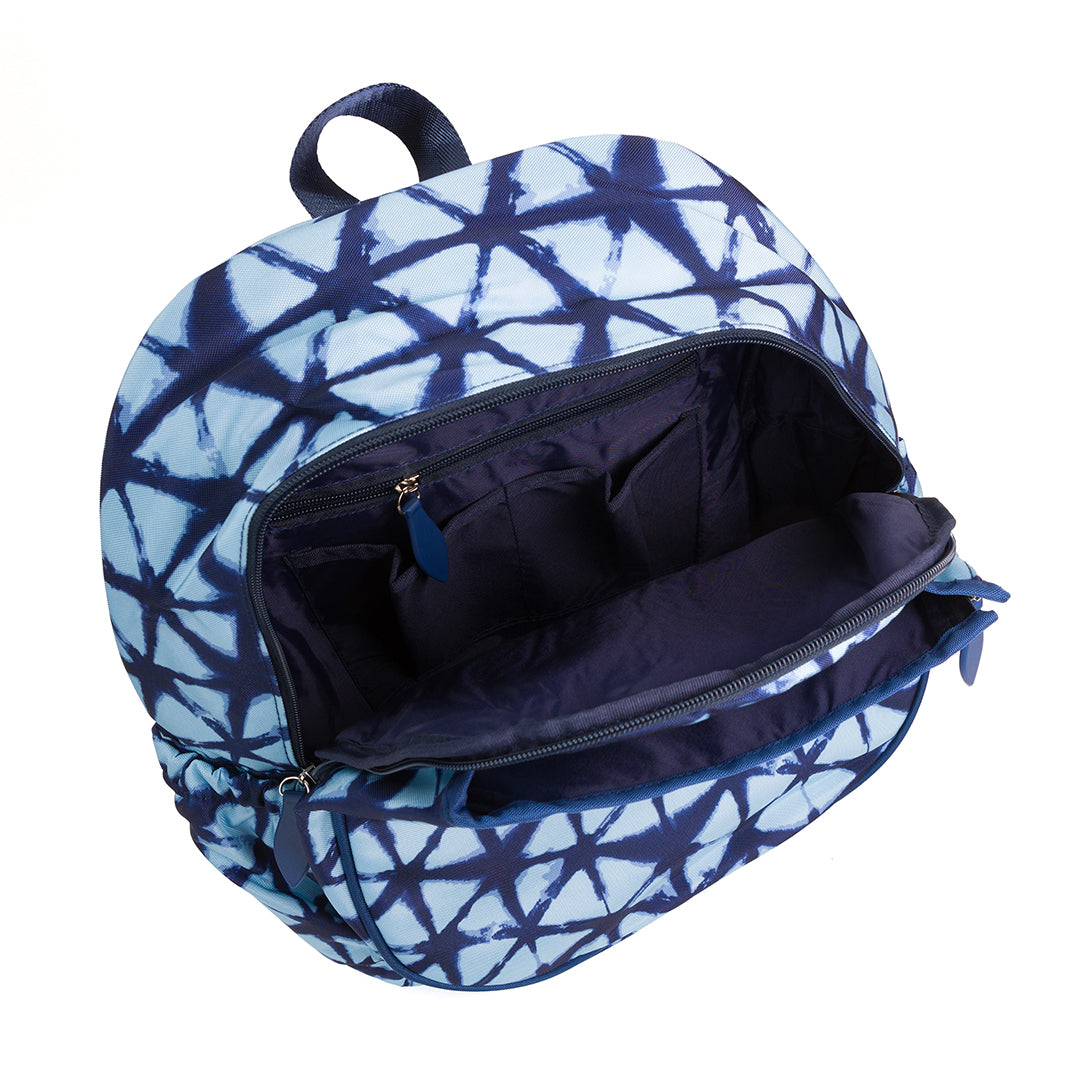 Inside view on navy and blue shibori tie dye pattern tennis backpack. Bag has pockets inside.