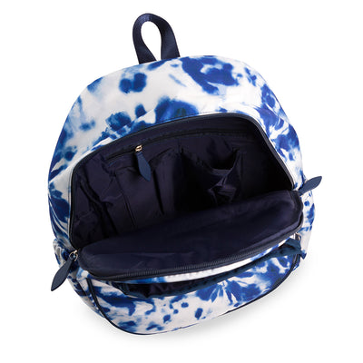 Inside view of navy and white tennis backpack showing the inside slip and zip pockets.