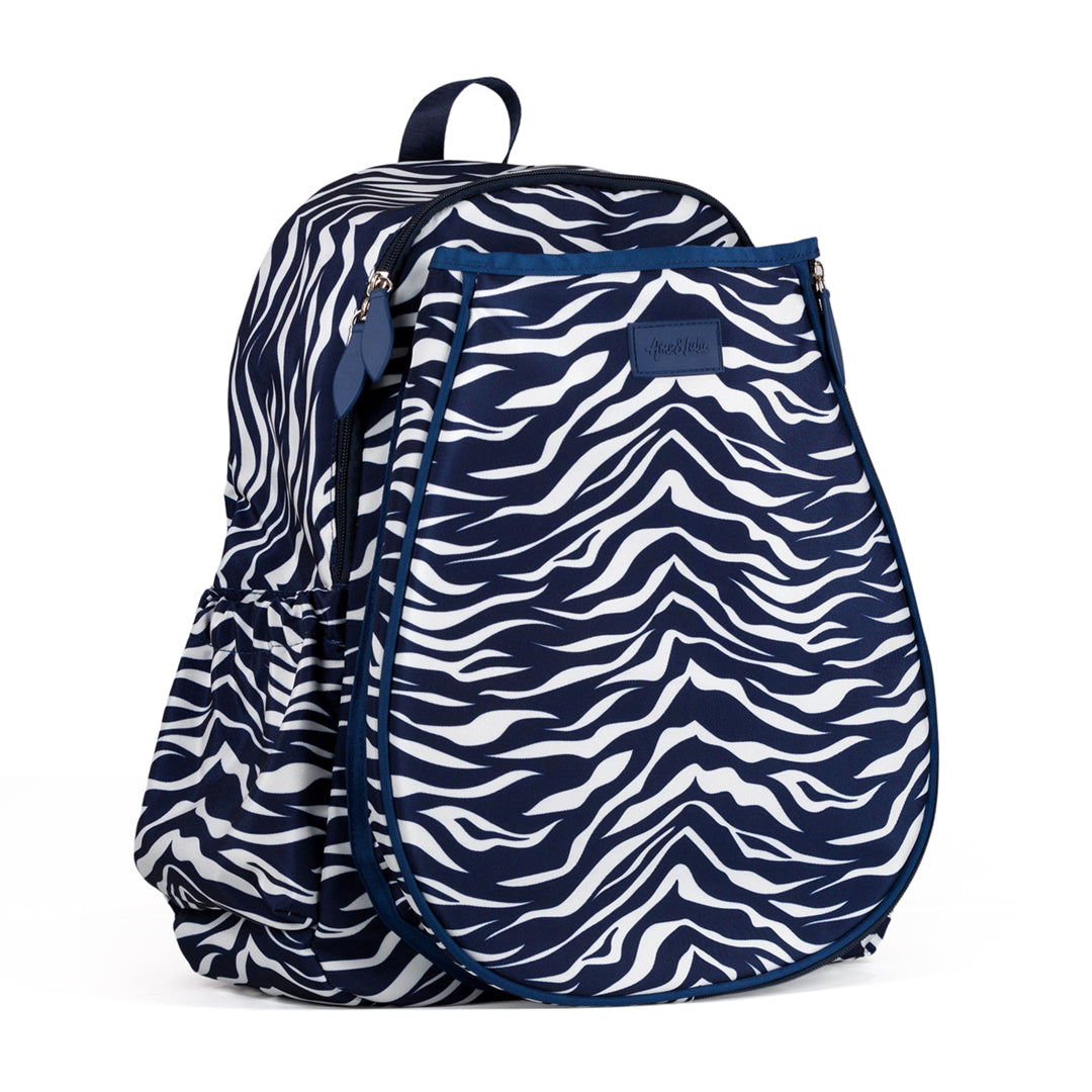 Side view of navy and white tiger pattern game on tennis backpack.