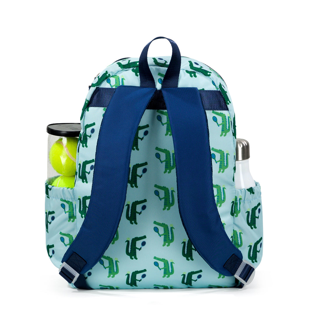 back view of blue kids tennis backpack with navy trim and repeat green alligator pattern