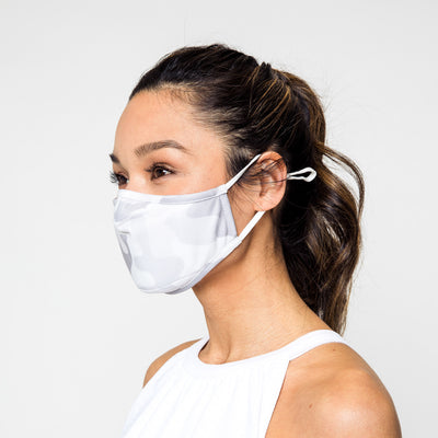 woman wearing grey camo pattern face mask