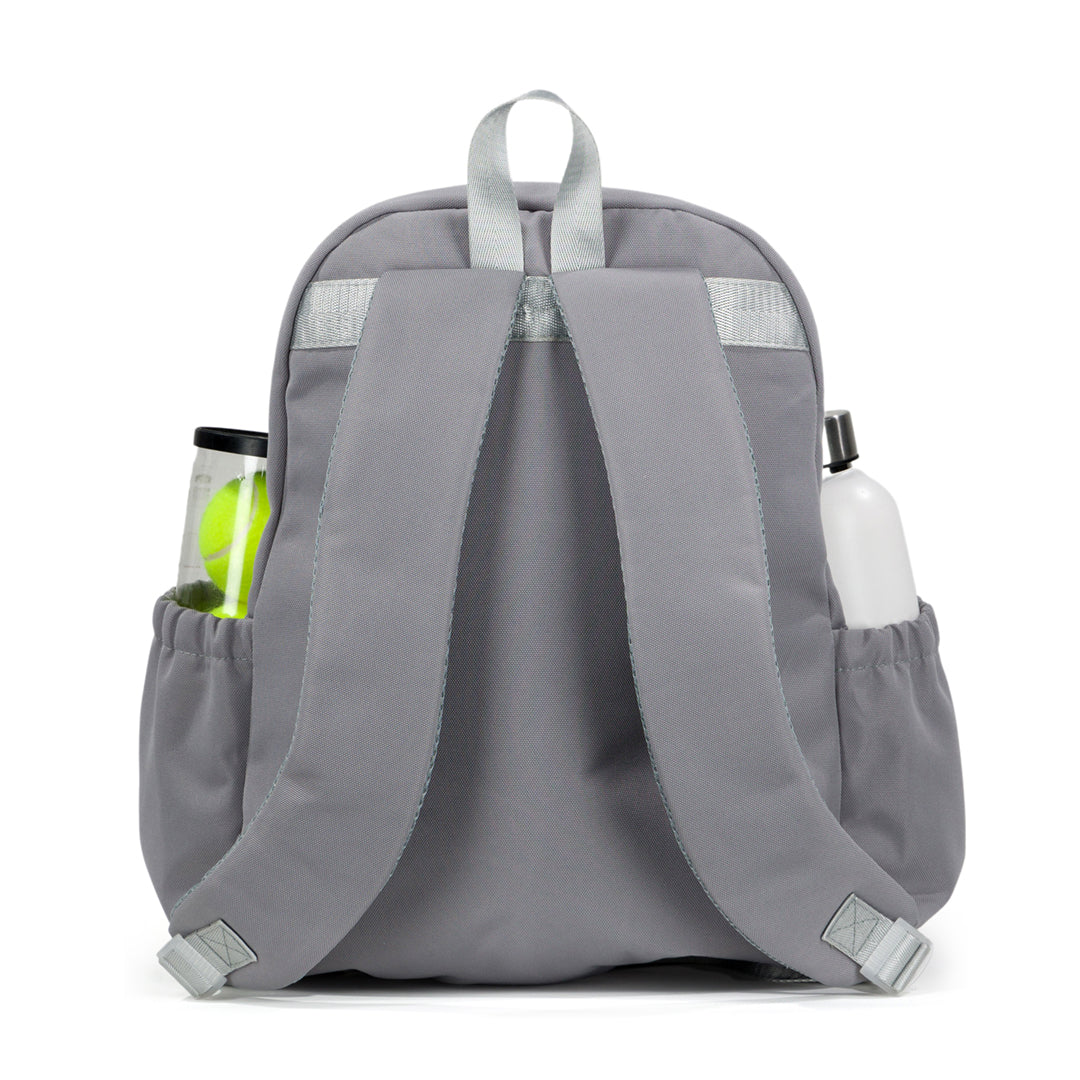 Back view of grey game time tennis backpack, with a water bottle and tennis balls in the side pockets.