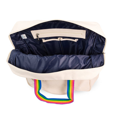 Interior view of tennis tote with navy interior and pockets inside.