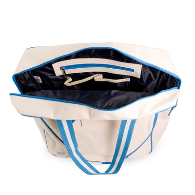 Inside view of canvas tennis tote with navy interior and pockets inside.