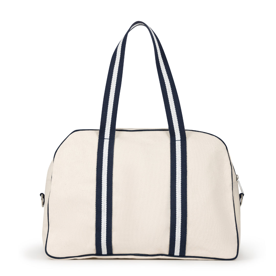 back view of natural colored canvas pickleball bag with navy and white cotton webbing straps 