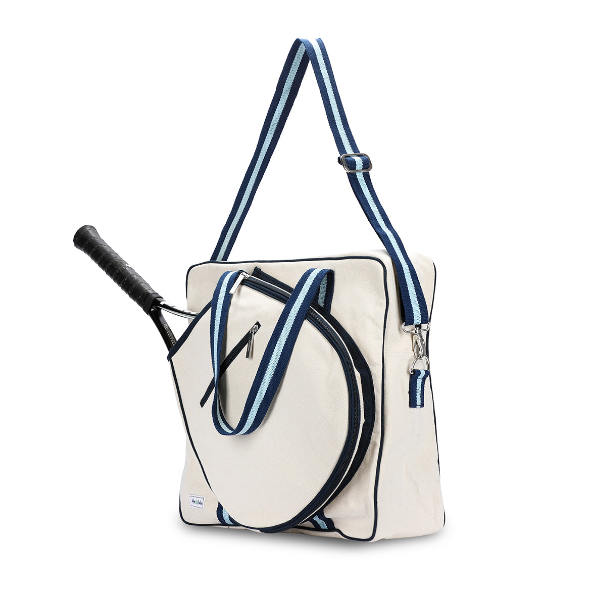 Side view of large canvas tennis tote with front pocket for tennis racquet. Straps are navy and blue striped.