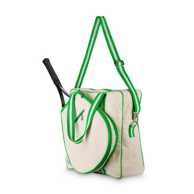 Side view of large canvas tennis tote with front pocket for tennis racquet. Tote has lime green trim and handles.