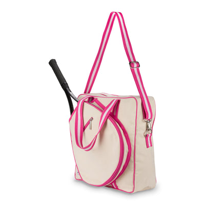 Side view of large canvas tennis tote with front pocket for tennis racquet. Tote has hot pink trim and handles.