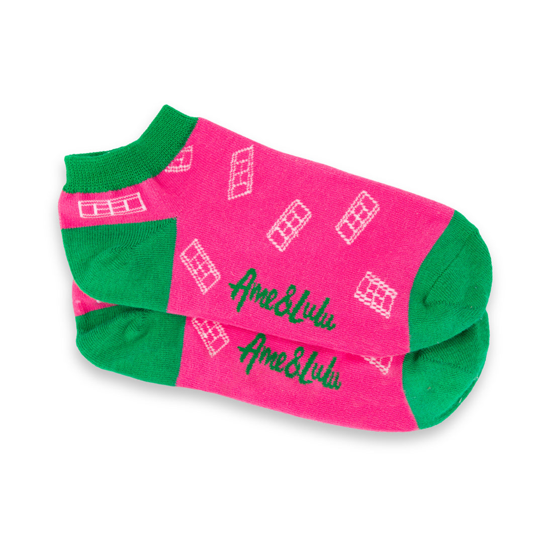 three pack of lawn tennis socks. Blue sock with pink trim, hot pink sock with green trim and yellow sock with red trim. All socks have white tennis court repeating pattern on them