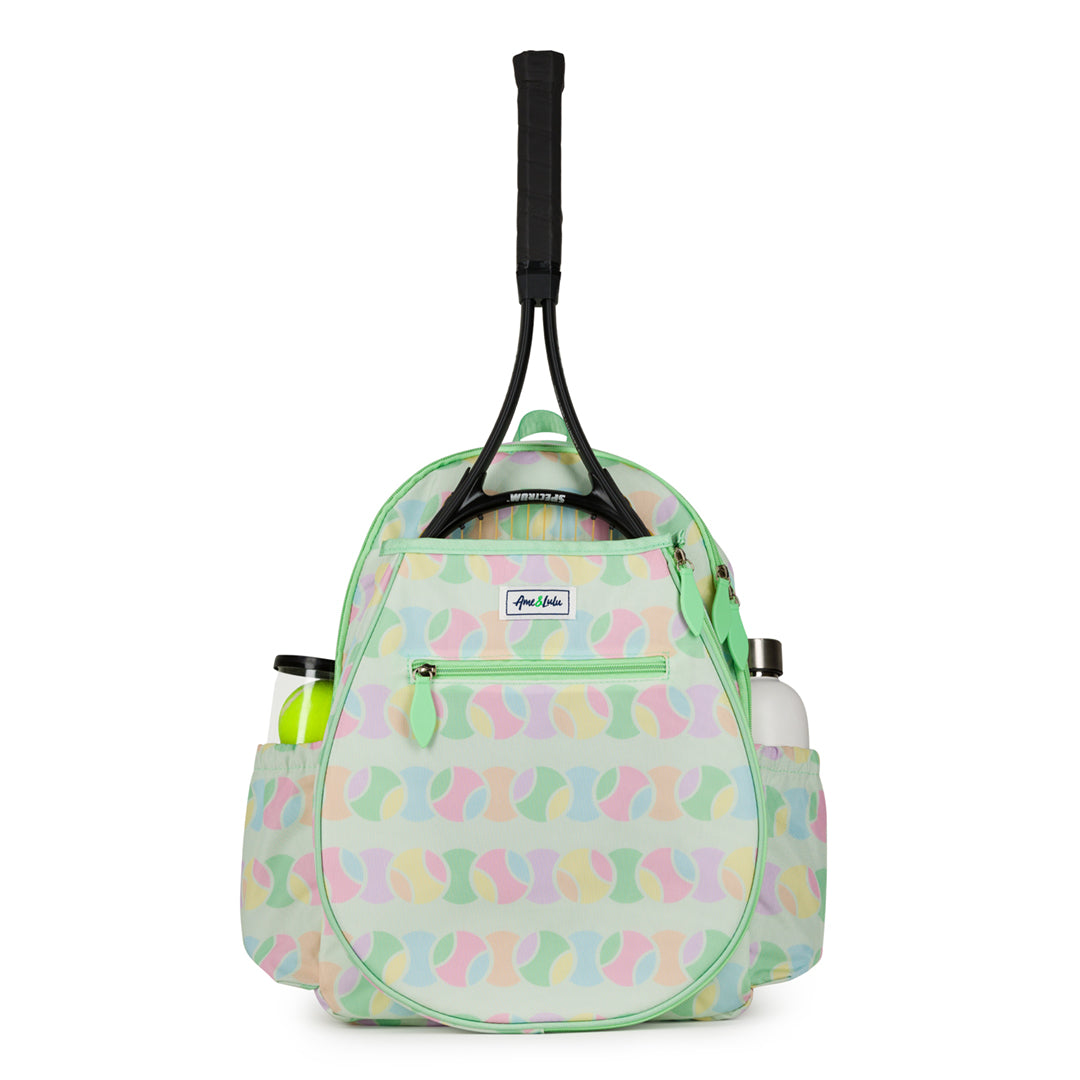 Front view of light green kids tennis backpack with repeating pastel tennis ball pattern.