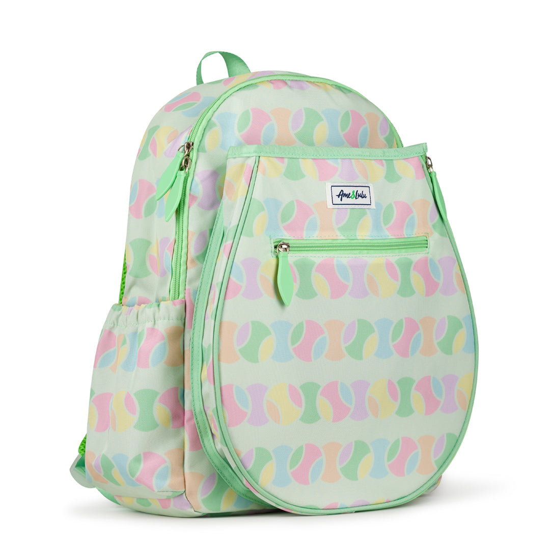 Side view of light green kids tennis backpack with repeating pastel tennis ball pattern.