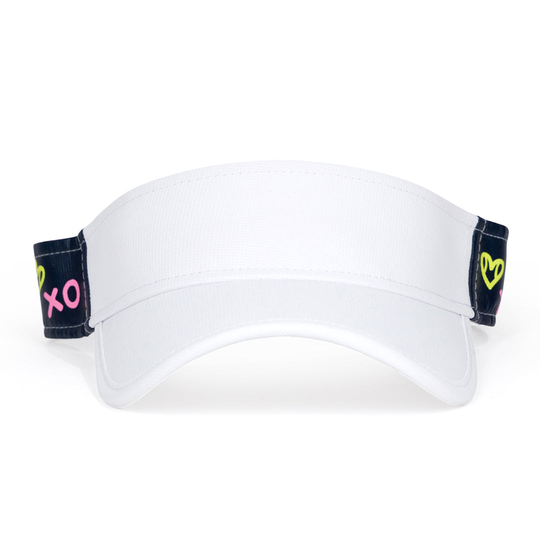 Front view of navy kids visor with green heart shaped tennis balls and pink x and o printed on the sides.