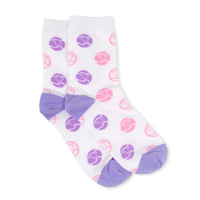 pair of white kids crew socks with purple and pink smiling tennis balls stitched all over socks