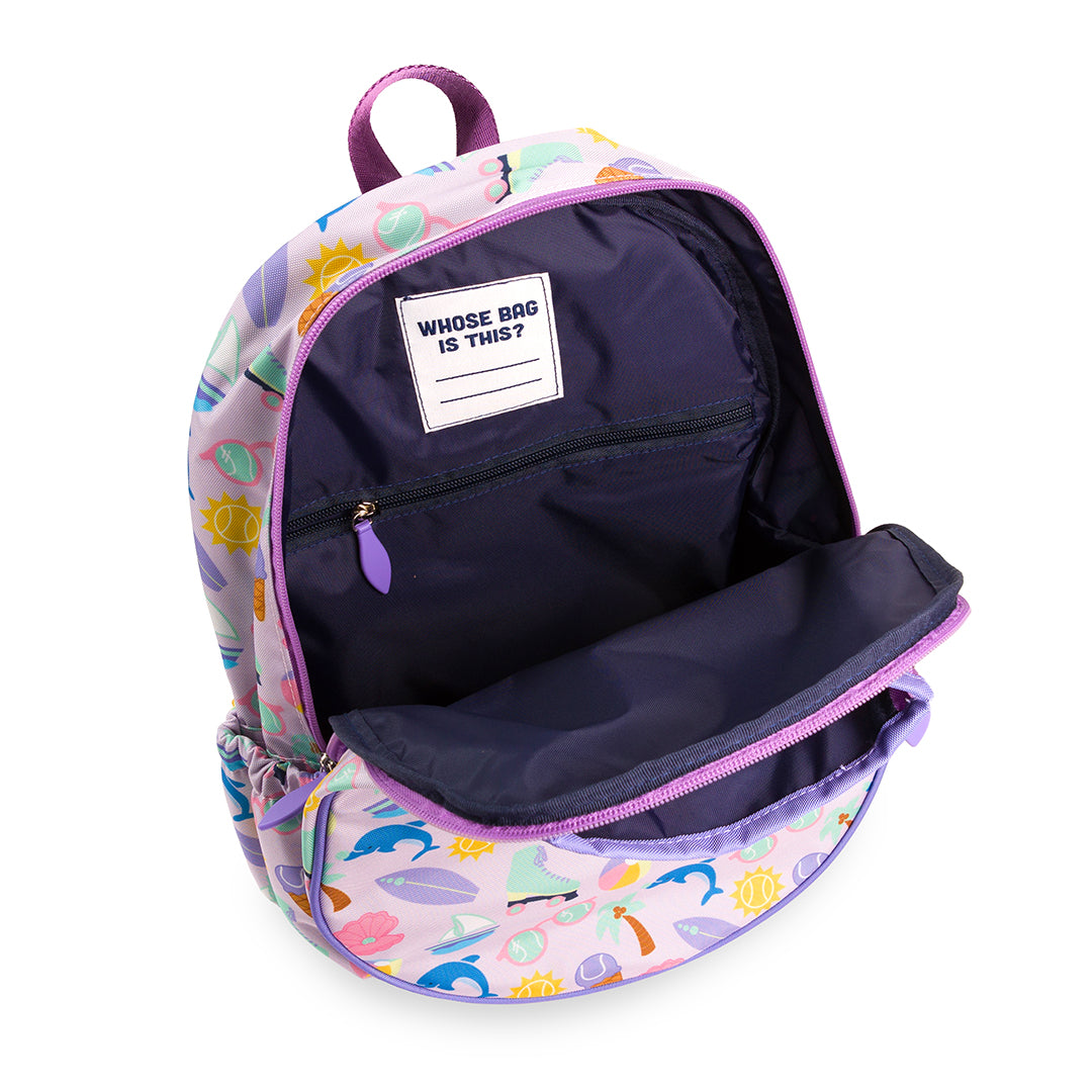 Inside view of purple kids tennis backpack. Backpack is covered in beach themed icons such as surfboard, boats, beach ball and palm trees.