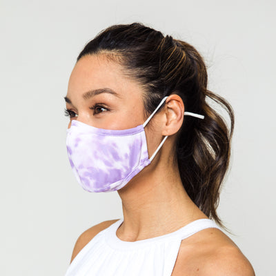 woman wears lavender tie dye pattern face mask