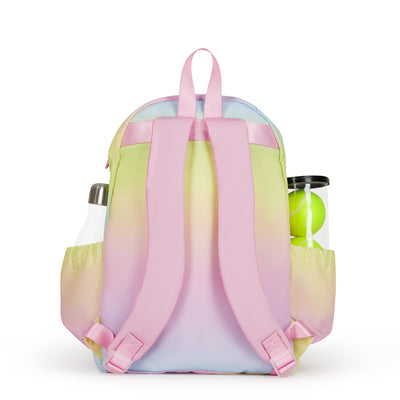 Back view of kids tennis backpack with rainbow ombre color. Backpack has water bottle and tennis balls in side pockets.