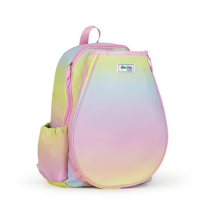 Side view of kids tennis backpack with rainbow ombre color. Backpack has water bottle and tennis balls in side pockets.