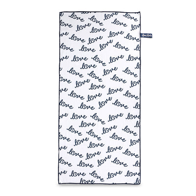 rectangular white towel with repeating pattern of the word love in a cursive font