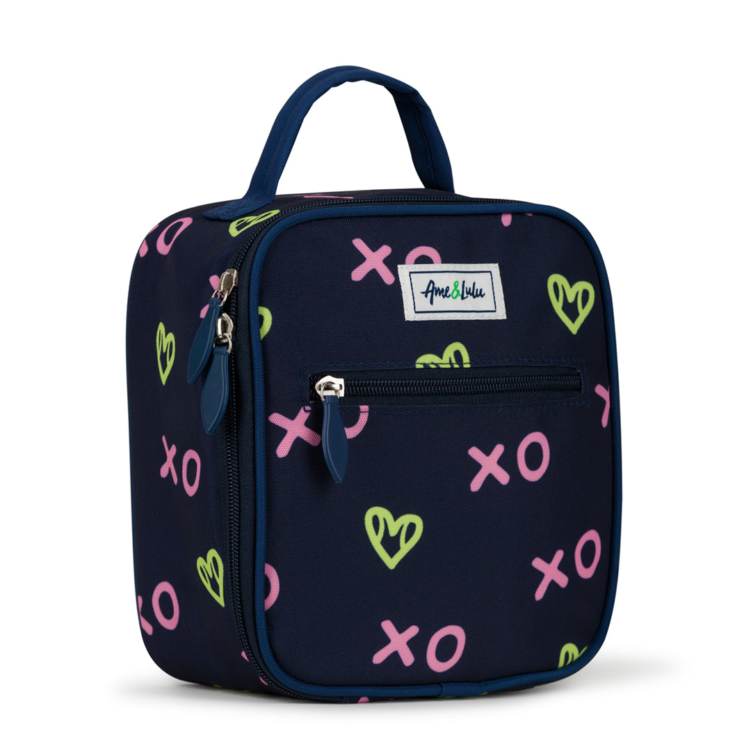 side view of navy kids lunch box with green heart shaped tennis ball pattern