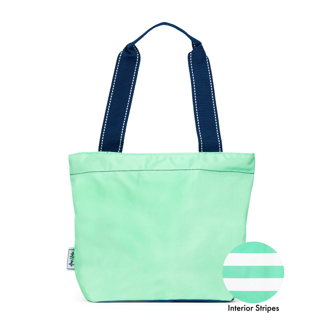 view of mint mini surfside tote with navy straps