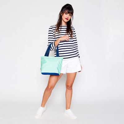 view of mint mini surfside tote with navy straps