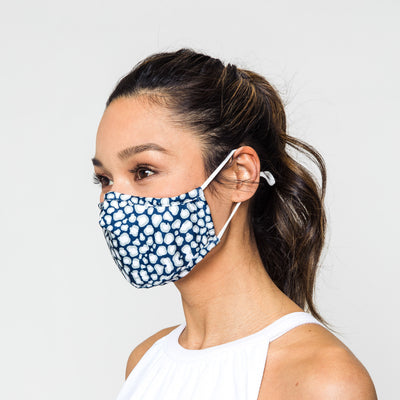 woman wearing a navy and grey leopard pattern face mask