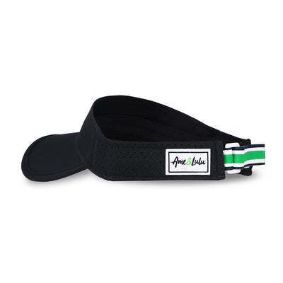 Side view of navy visor with white, navy and green striped adjustable strap on the back.