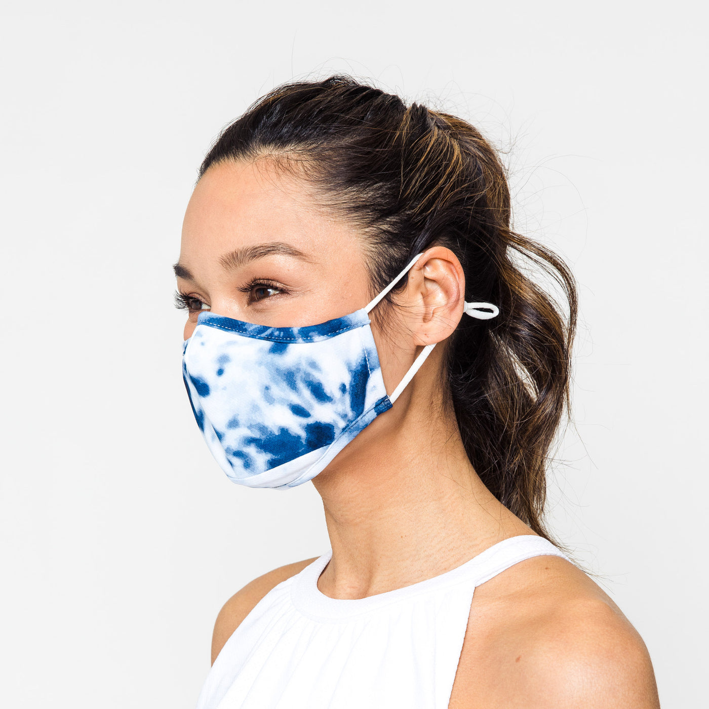 woman wearing navy tie dye pattern face mask