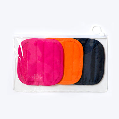 Clear bag holding three color handle caps. Hot pink, orange and navy caps.