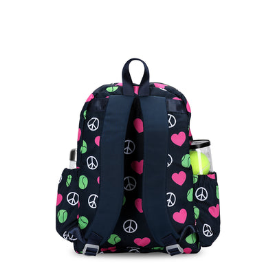 back view of navy kids tennis backpack with repeating pattern of white peace signs, pink hearts and green tennis balls.