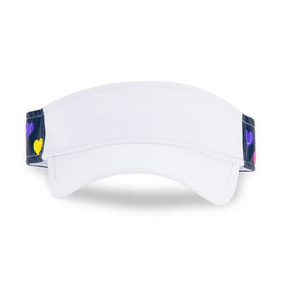 Front view of navy kids visor with rainbow heart shaped tennis balls printed on sides