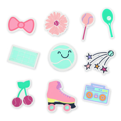 Flat view of patches for tennis backpack. Patches are pink bow, pink flower, pink lollipop, green tennis racquet, green tennis court, smiling tennis ball, shooting star, cherries, roller skate and boom box.