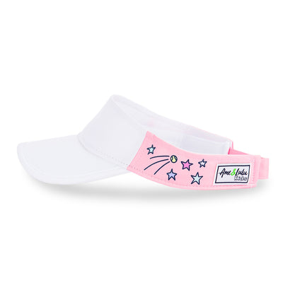 Side view of light pink kids visor with shooting stars and tennis balls printed on the sides.