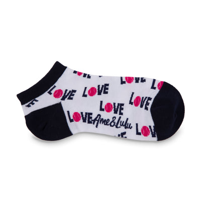 white sock with navy heels and toes. The word love in navy with a pink tennis ball for the letter o are printed around the socks