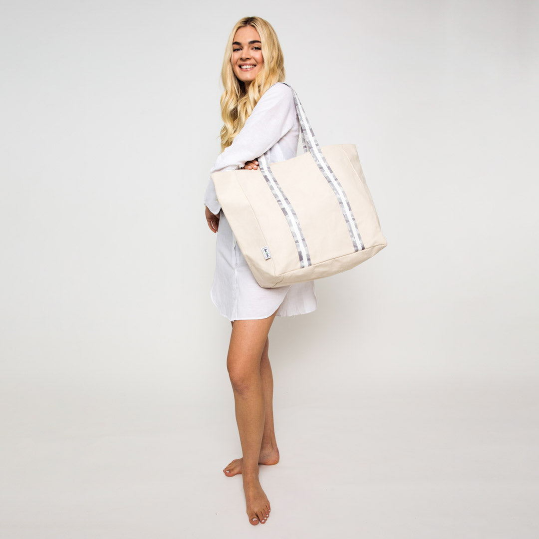 woman wearing natural canvas tote with grey camo cotton webbing straps