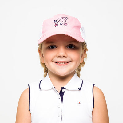 Little girl wearing pink and white kids trucker hat with shooting stars embroidered on the front