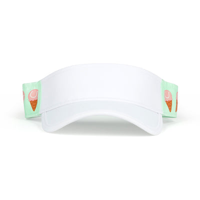 Front view of light green kids visor with pink tennis ball ice creams on the sides.