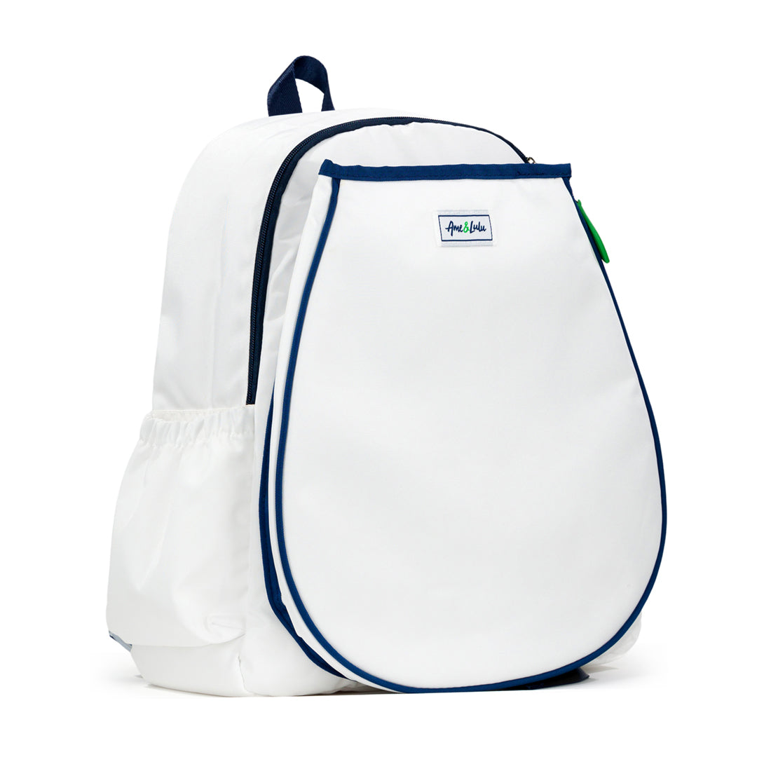 Side view of white tennis backpack with racquet pocket. Bag has navy trim and green zipper pulls.