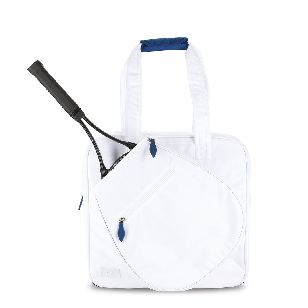Front view of white tennis tote with navy handle and tennis racquet in front pocket