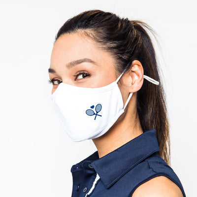 white face mask with navy crossed racquets printed on one side
