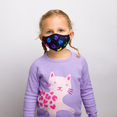girl wearing navy with rainbow color heart shaped tennis ball pattern kids face mask