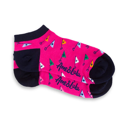 pair of hot pink socks with rainbow flags
