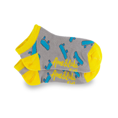 pair of grey kids socks with yellow heel and toes with blue skateboards stitched on