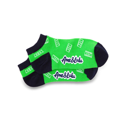 a pair of green socks with navy heels and toes. White tennis courts are a repeat pattern on the socks